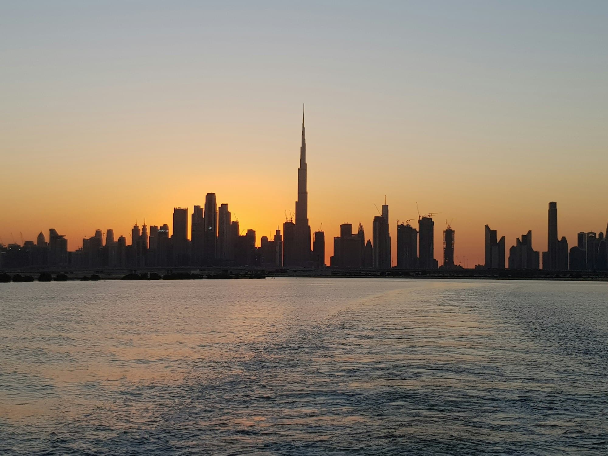 Dubai skyline with the Burj Khalifa at sunset